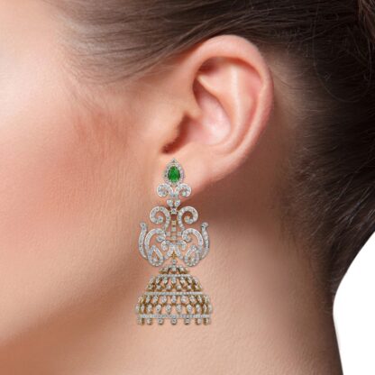 Yellow gold ornate jhumka earrings, close-up of scrollwork