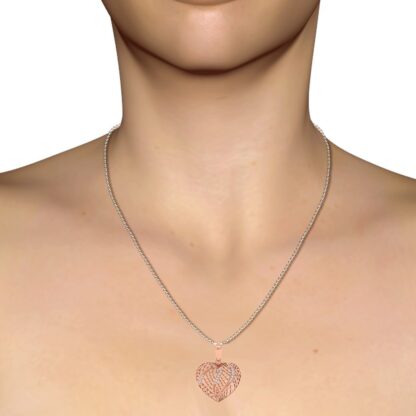 Rose gold heart pendant, close-up of diamond outline
