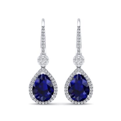 Front view of white gold dangle earrings with a pear sapphire and diamond halo