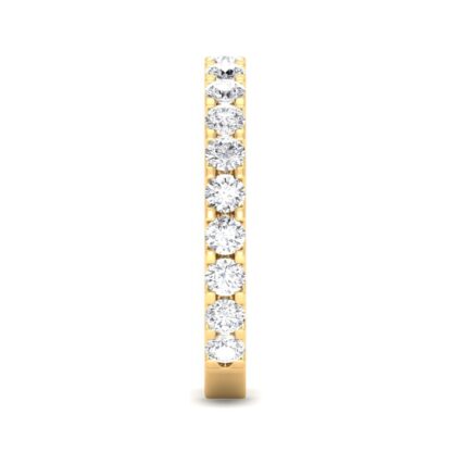 Side view of yellow gold U-prong three-quarter eternity ring showing the band depth and stone setting