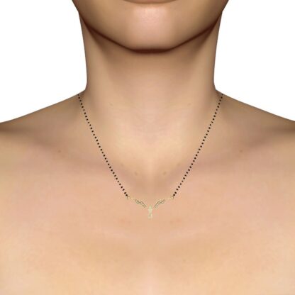 Angled view of yellow gold diamond wing bar mangalsutra pendant