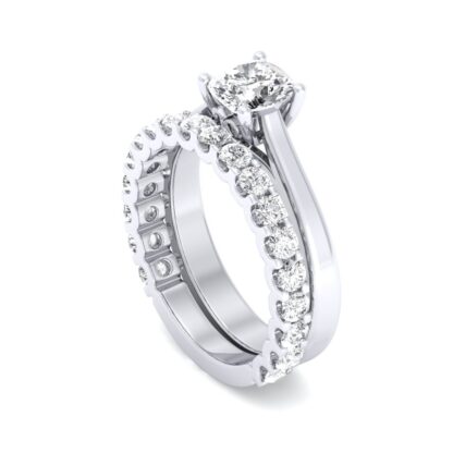 White gold U-prong three-quarter eternity ring stacked with an oval diamond solitaire engagement ring
