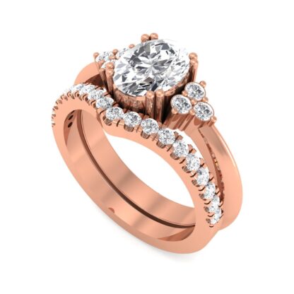 Rose gold V contour pave diamond band nestled against an oval diamond engagement ring with side stone trios
