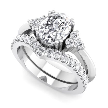 White gold or platinum V contour pave diamond band nestled against an oval diamond engagement ring with side stone trios