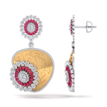 Angled view of two-tone earrings showing the hand-engraved paisley detail