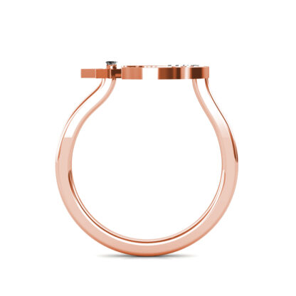Through-finger view of rose gold crescent moon and star diamond ring showing the band profile