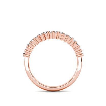 Through-finger view of rose gold prong-set baguette diamond half eternity ring showing the band profile