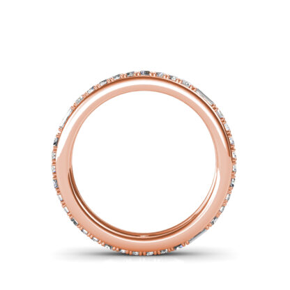 Through-finger view of rose gold baguette and round diamond eternity ring showing the band profile