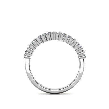 Through-finger view of white gold or platinum prong-set baguette diamond half eternity ring showing the band profile
