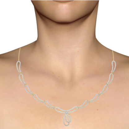 Yellow gold diamond scallop loop necklace worn on a model's neckline