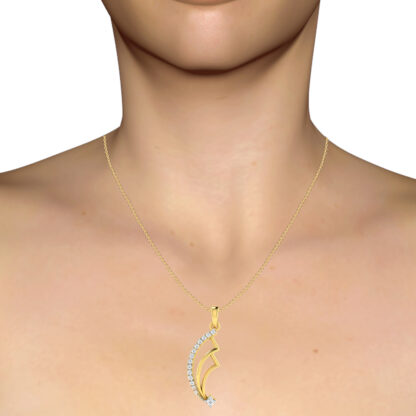 Yellow gold diamond fan pendant worn on a model's neckline