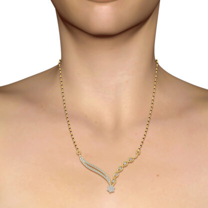 Yellow gold woven diamond wing mangalsutra worn on a model's neckline