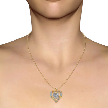 Yellow gold diamond heart pendant worn on a model's neckline