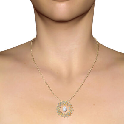 Yellow gold diamond and pearl pendant worn on a model's neckline