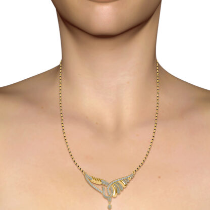 Yellow gold diamond mangalsutra worn on a model's neckline