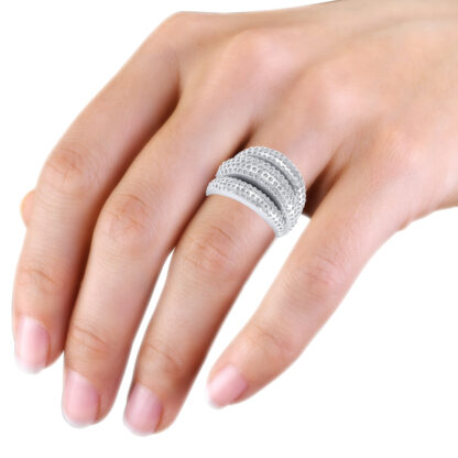 White gold triple dome flush-set diamond ring worn on the hand