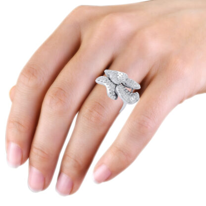 White gold flush-set diamond petal flower ring worn on the hand
