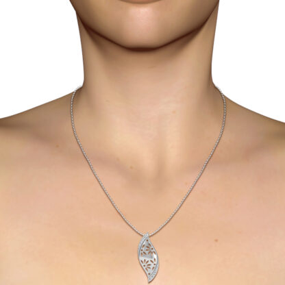 White gold curved leaf diamond pendant worn on a model's neckline