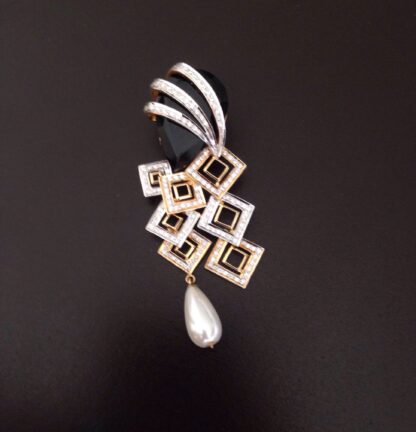 Close-up of black onyx pendant showing the diamond fan and pearl drop