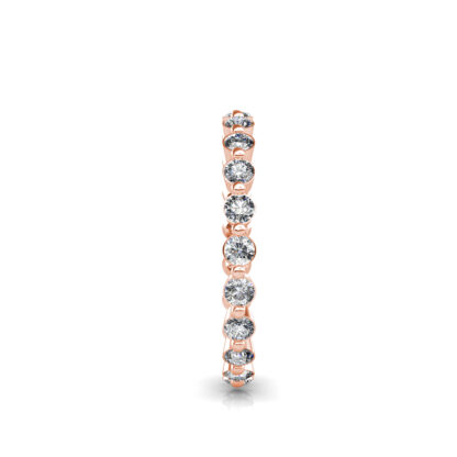 Side view of rose gold individually set diamond eternity band showing the band depth and setting