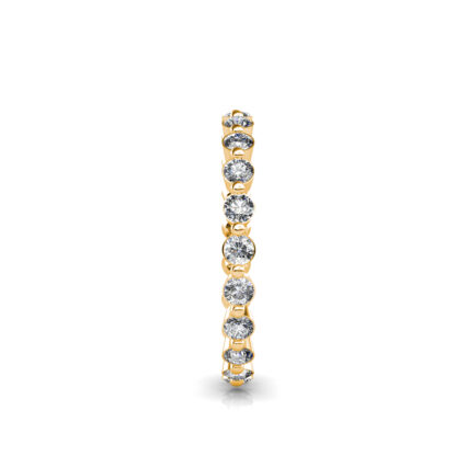 Side view of yellow gold individually set diamond eternity band showing the band depth and setting