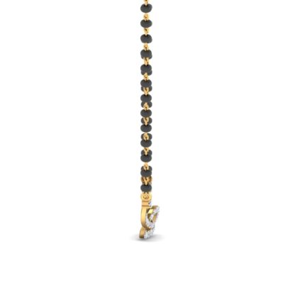 Angled view of yellow gold mangalsutra showing the diamond knot detail
