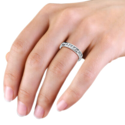 White gold channel-set diamond full eternity ring worn on the hand