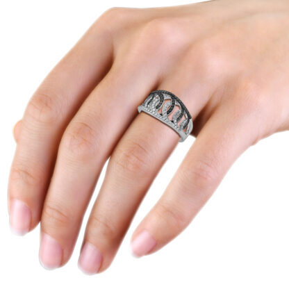 White gold black and white diamond weave ring worn on hand
