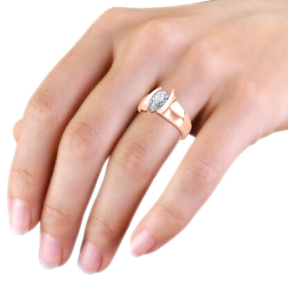 Rose gold pear solitaire engagement ring worn on a woman's hand