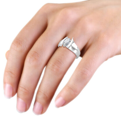 Pear solitaire engagement ring in white gold or platinum worn on a woman's hand