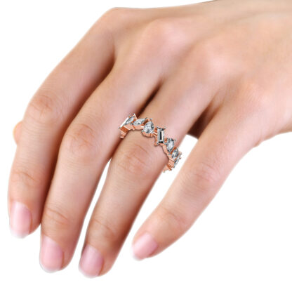 Rose gold mixed shape diamond eternity band worn on the hand