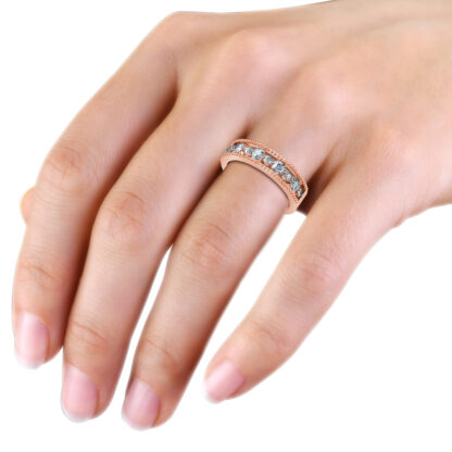 Rose gold beaded milgrain graduated diamond band worn on the hand
