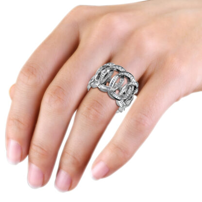 White gold or platinum interlocking loop baguette diamond wide ring worn on the hand