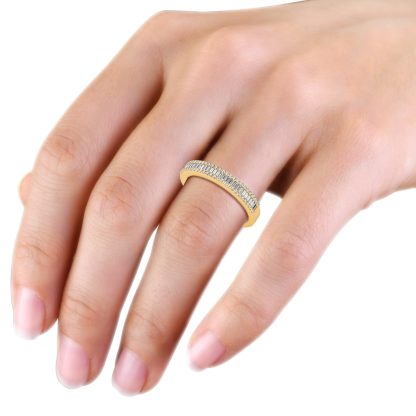 Yellow gold baguette diamond half eternity band worn on the hand