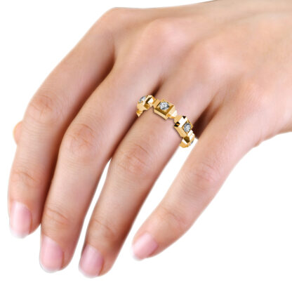 Yellow gold geometric block bezel diamond band worn on the hand