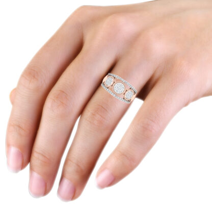 Rose gold triple diamond cluster ring worn on hand