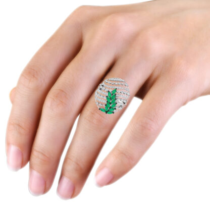 White gold emerald diamond dome ring worn on hand