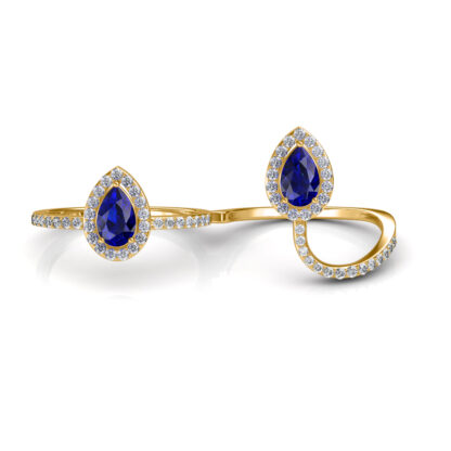 Yellow gold sapphire two-finger ring worn on hand