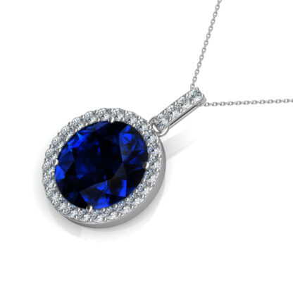 Angled view of white gold sapphire diamond pendant showing the chain bail