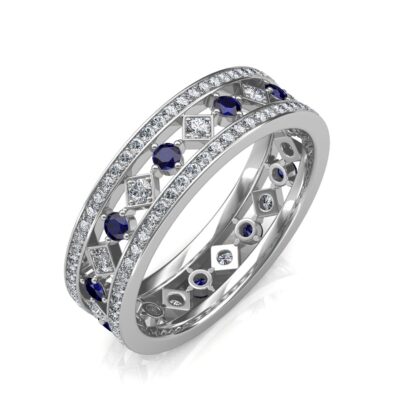 Perspective view of wide white gold eternity band with pave diamond edges and a center row of sapphires and diamonds