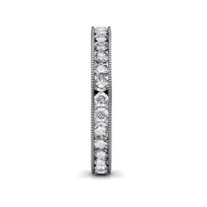 Side view of white gold milgrain channel-set diamond eternity ring showing the band depth and stone setting