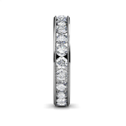 Side view of white gold milgrain channel-set diamond eternity ring showing the band depth and stone setting