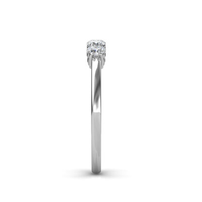 Side view of white gold or platinum five-stone ring showing the slim band