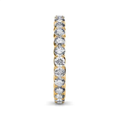 Side view of yellow gold U-prong full eternity ring with twisted gallery showing the band depth and stone setting