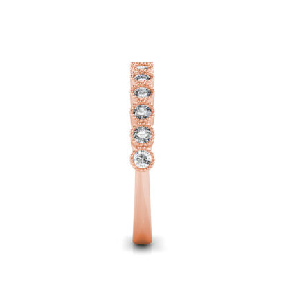 Side view of rose gold milgrain bezel diamond half eternity band showing the band depth and setting