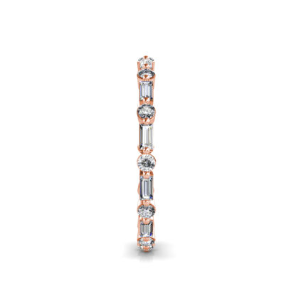Side view of rose gold baguette and round diamond station eternity band showing the band depth and setting