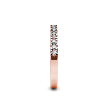 Side view of rose gold shared-prong diamond half eternity band showing the band depth and stone setting