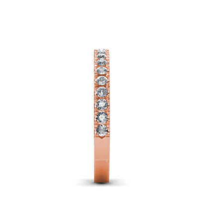Side view of rose gold prong-set diamond half eternity ring showing the band depth and stone setting