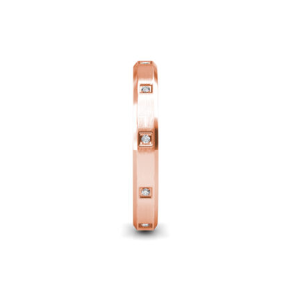 Side view of rose gold beveled edge flush-set diamond band showing the band depth and stone setting