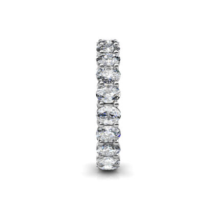 Side view of white gold or platinum oval diamond full eternity ring showing the band depth and stone setting